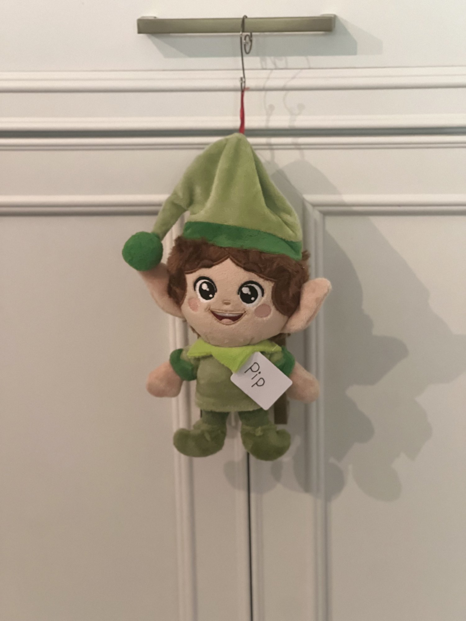 Green Kringle Elf named Pip with a handwritten name tag